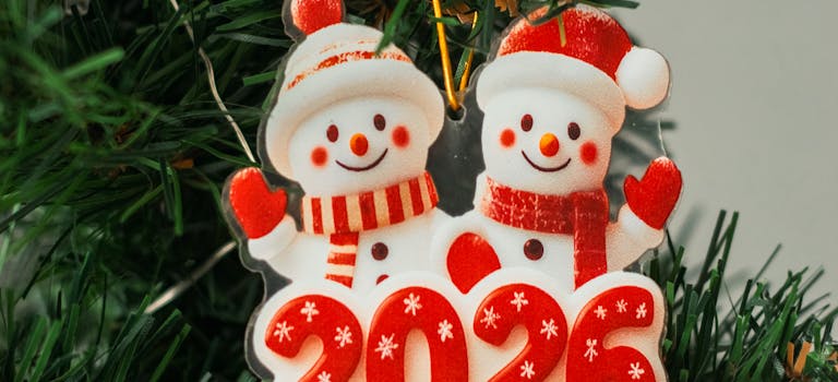 2026 Christmas tree snowman ornament with red decoration.